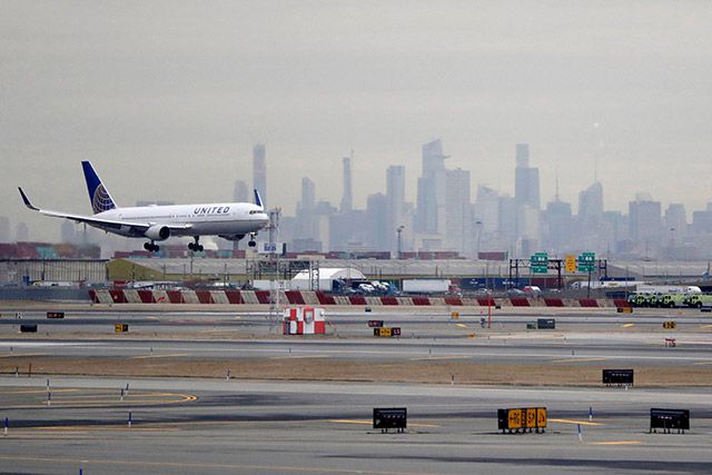 A United Airlines jet prepares to land at Newark Liberty International Airport on January 23, 2019